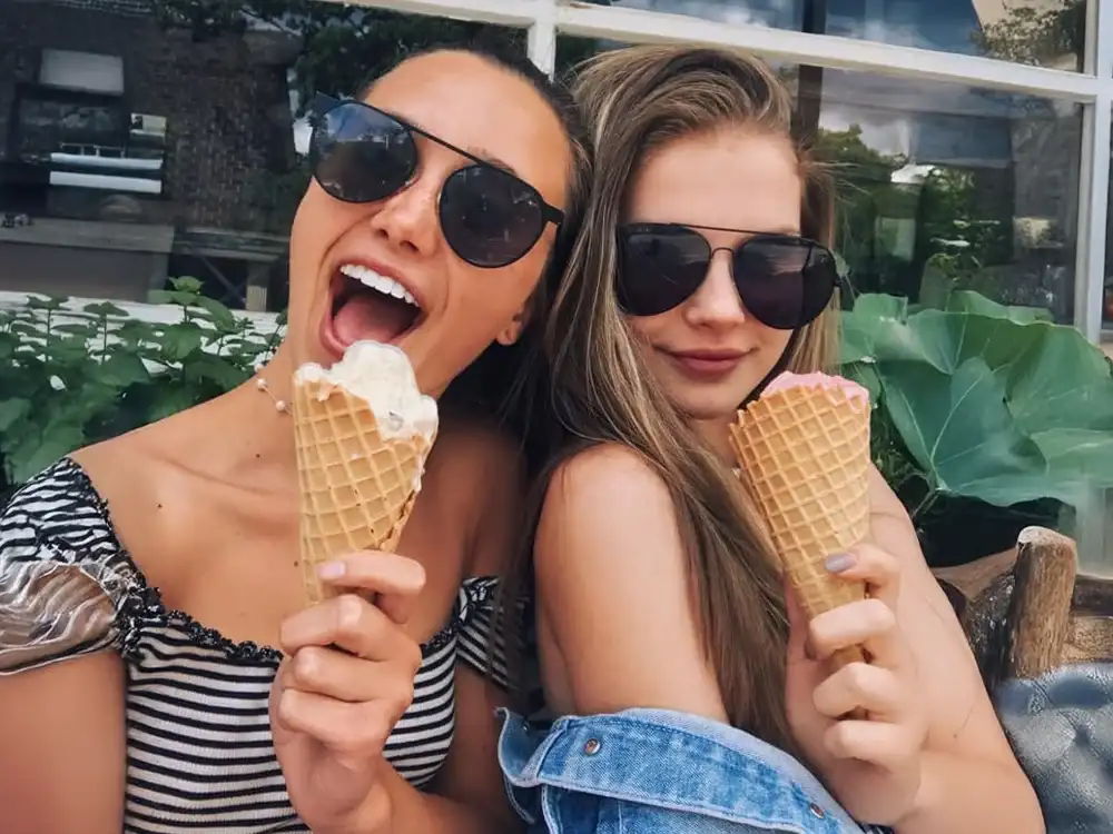 Home 64 Happy friends enjoying ice cream cones at Keds Ice Cream