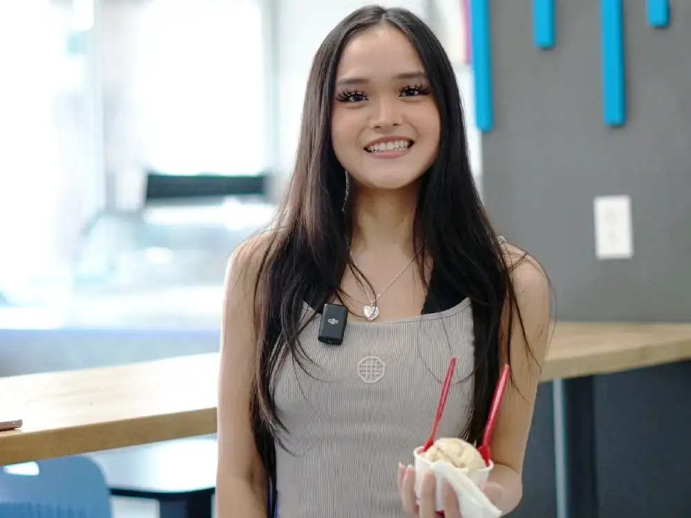 Home 67 Happy customer enjoying ice cream at Keds Ice Cream shop